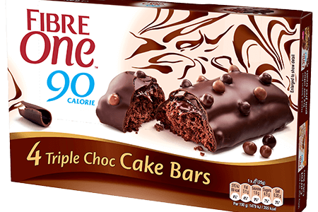 Box of Fibre One 90 Calorie Triple Choc Cake Bars, showing four chocolate-covered bars on the packaging.